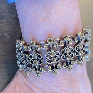 Beautiful gold toned, jeweled bracelet.